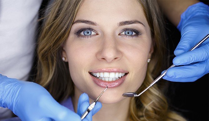 Woman receiving periodontal treatment