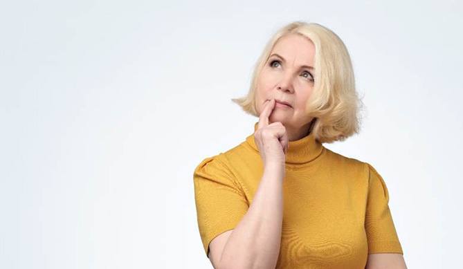 Woman with All-On-4/ Pro Arch dental implant FAQs in San Antonio