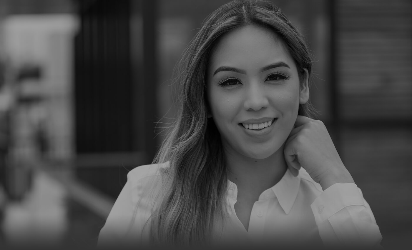 Woman with flawless smile after visiting Lorenzana Periodontics