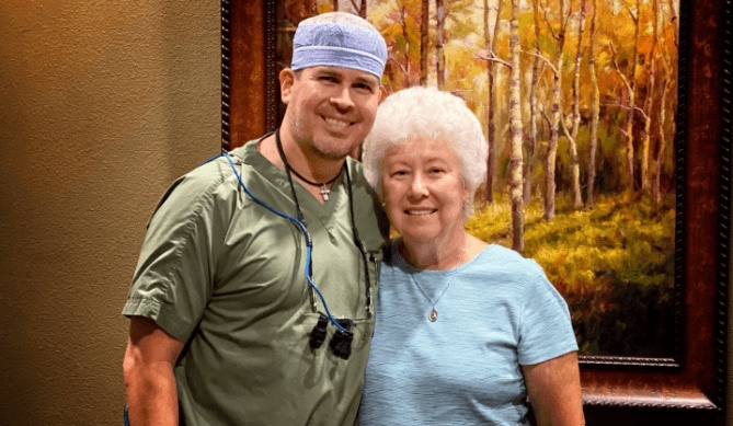 Docotor Lorenzana smiling with a patient