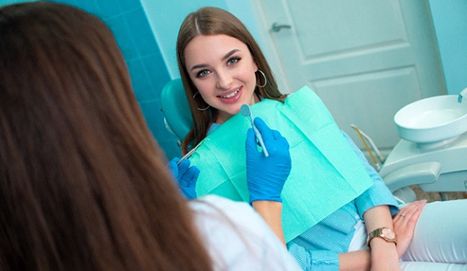 Woman smiling with a sedation dentist in San Antonio