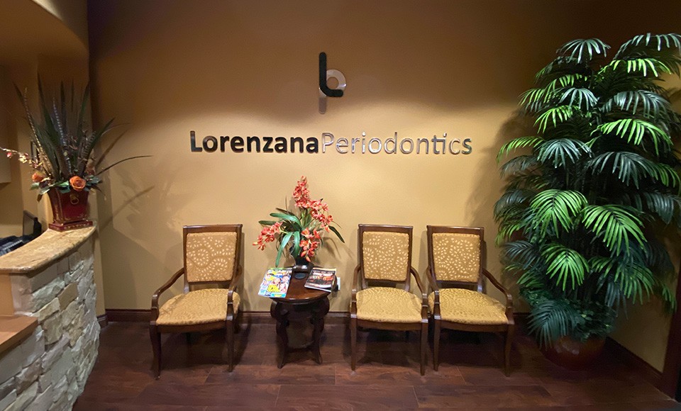 Lorenzana Periodontics sign on office wall