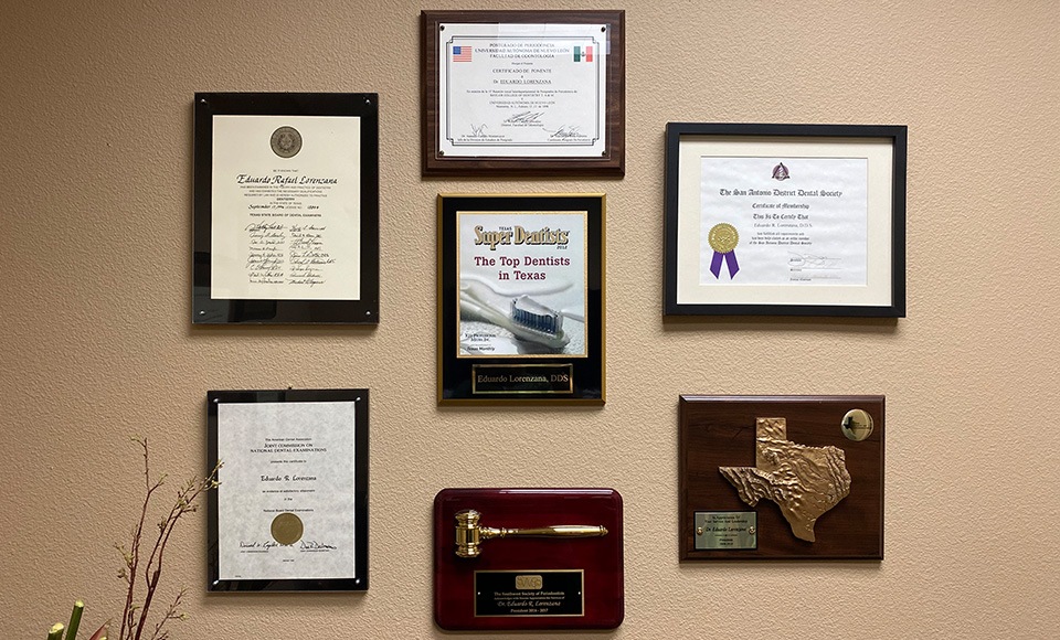 Certificates and diplomas on office wall