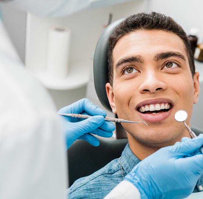 Smiling man about to undergo dental exam