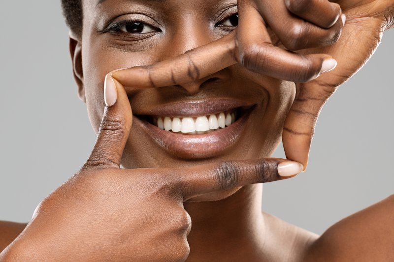 Woman smiling after receiving gummy smile treatment in San Antonio